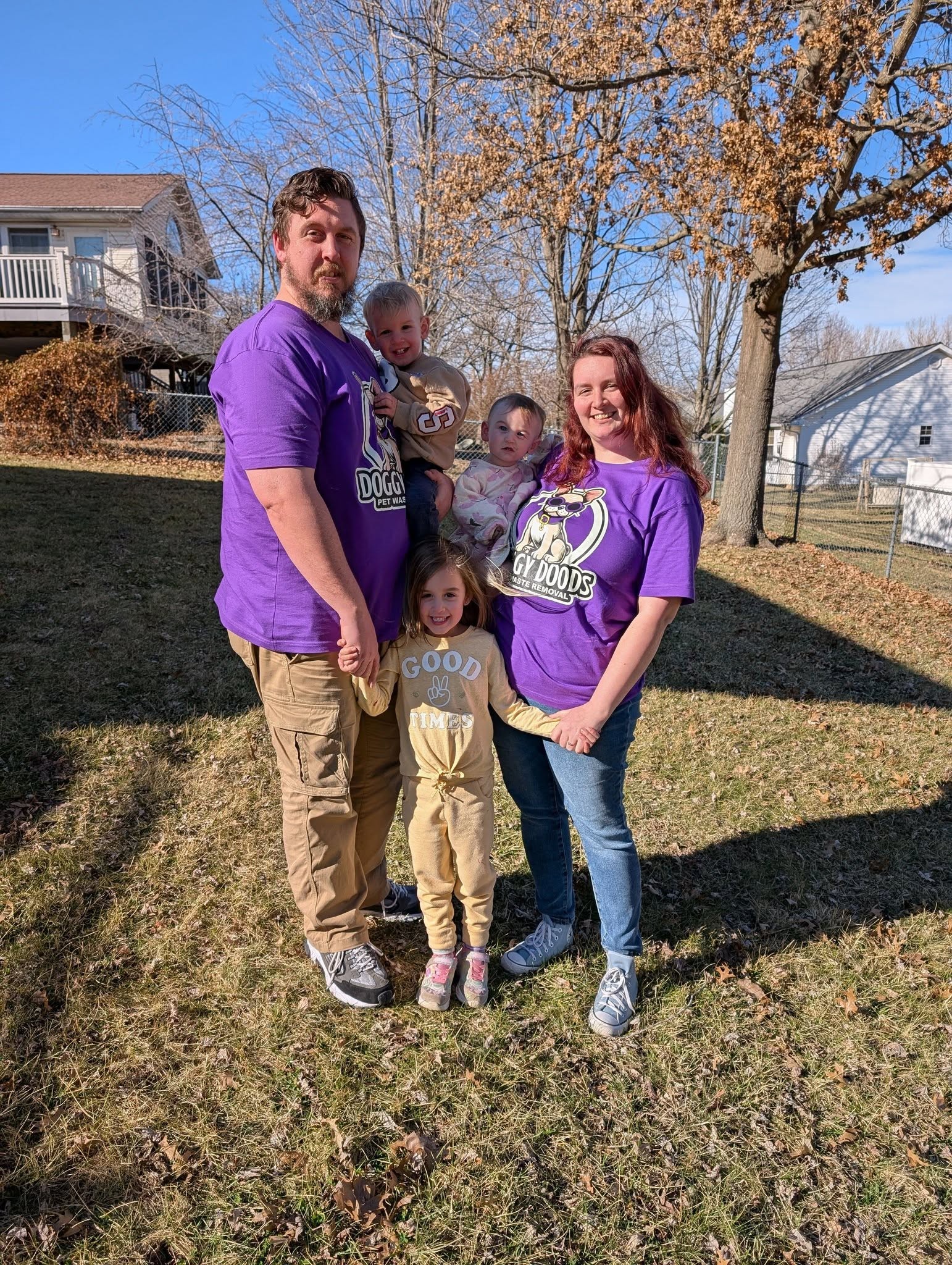 Doggy Doods owners Eugene and Harley Hurst with their children, the family behind St. Charles County's trusted pooper scooper service.
